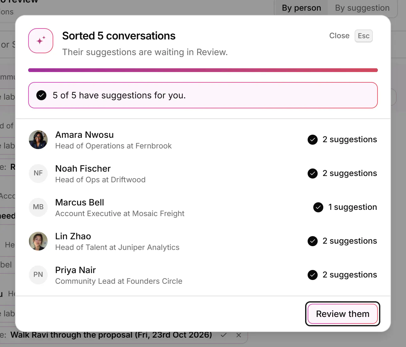 A dialog saying five conversations were sorted and their suggestions are waiting in Review, with a Review them button.