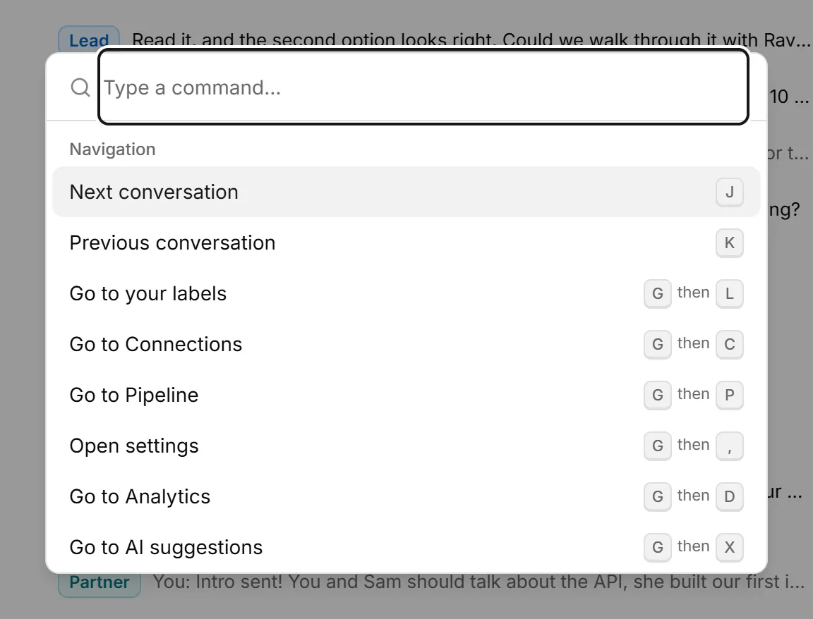 The command palette open over the inbox, listing actions grouped under Navigation, Selection and Conversation, each with its key.